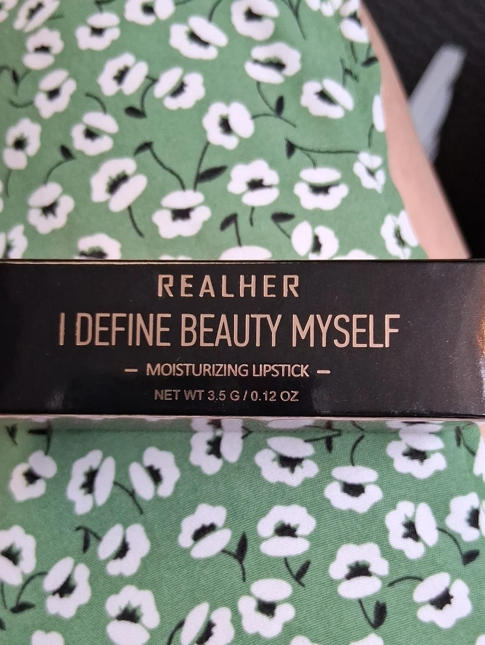 RealHer Moisturizing Lipstick in Black Packaging with Gold Lettering